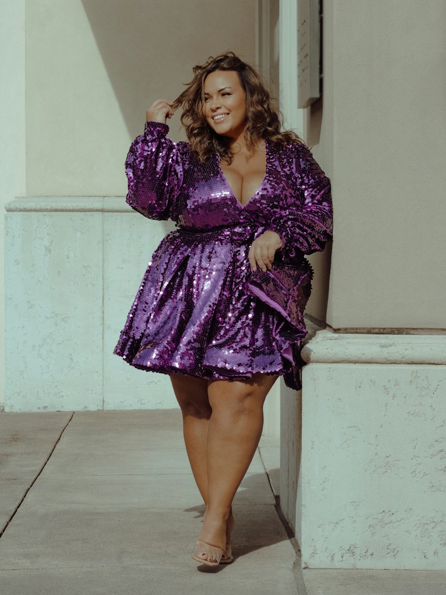 Woman in a purple sequin mini dress